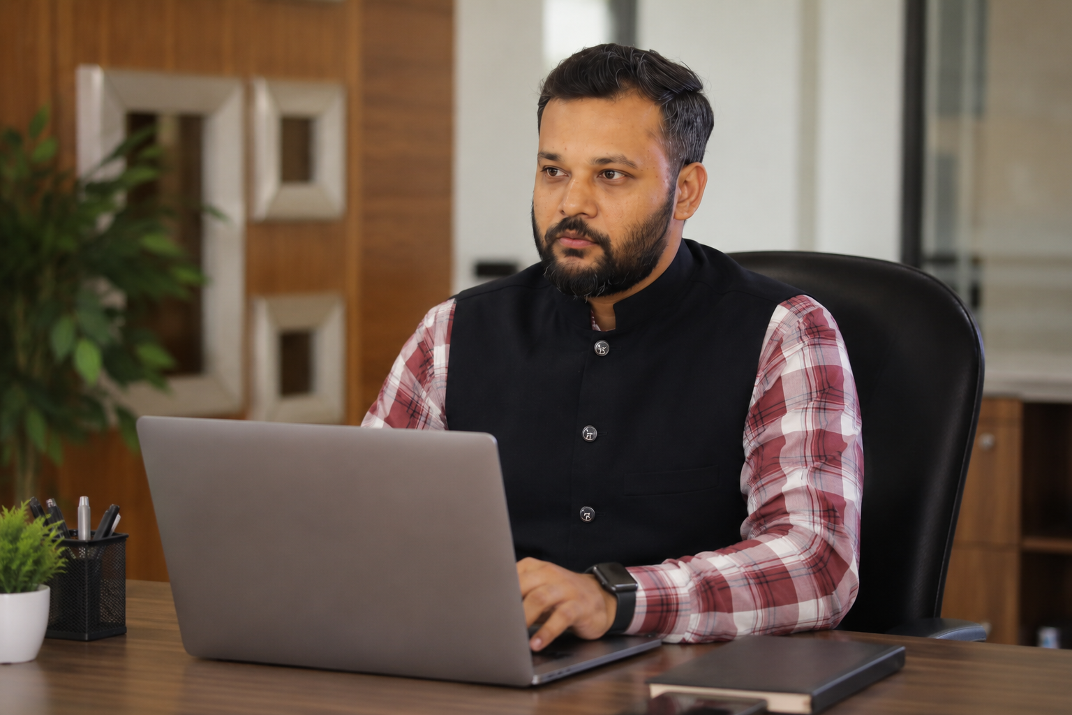 Bhavesh Bhuva working at his desk